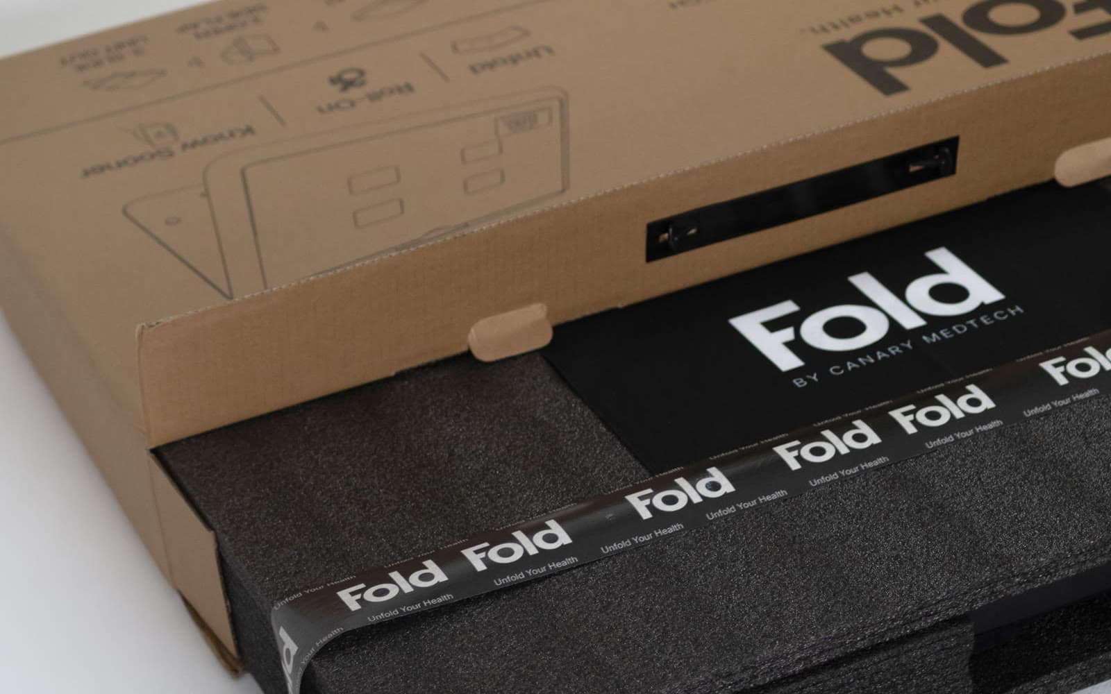 The opened Fold box with the scale inside, wrapped in protective foam.